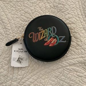Brand new Coach Wizard of Oz round coin case.